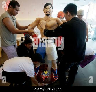Zach Yonzon, owner of The Bunny Baker cafe, puts finishing touches on
