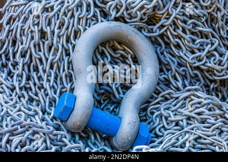 Steel eyelet with screw bolt and chain in Portofino harbour, Portofino, Liguria, Italy Stock Photo