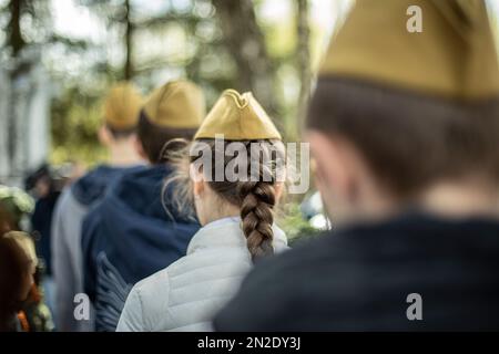 Girls in military uniform in Russia. Mourning ceremony in honor of victory over fascism. Details of memorable military date. Students at Tomb of Unkno Stock Photo