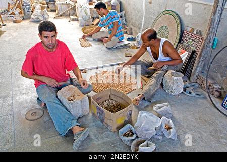 Mosaic stones are painstakingly made, Fes, Morocco Stock Photo