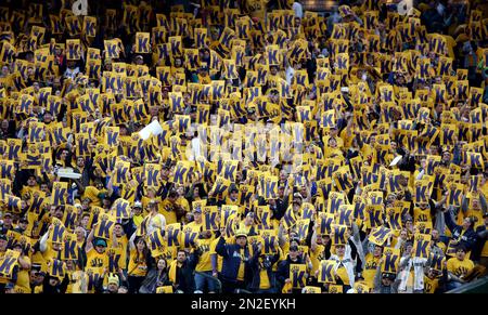 Seattle Mariners fans hold up signs mocking Canada during a baseball game  between the Mariners and the Toronto Blue Jays, Friday, July 8, 2022, in  Seattle. The sign on the left refers