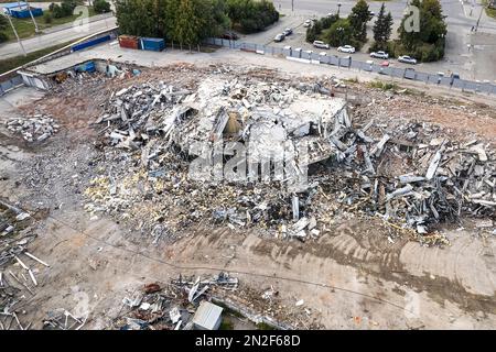 Top view of the destroyed building. Aerial view of the ruins. smoke ...