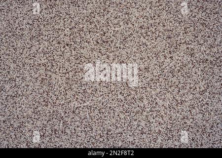 Background from a wall made of grainy brown plaster Stock Photo
