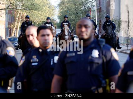 Baltimore police are mounted on horses as they guard the department's Western District police station during a march for Freddie Gray, Wednesday, April 22, 2015, in Baltimore. Gray died from spinal injuries about a week after he was arrested and transported in a police van. (AP Photo/Alex Brandon)