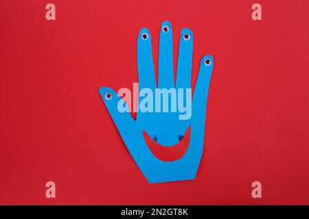Funny Hand Shaped Monster on Light Blue Background, Top View with