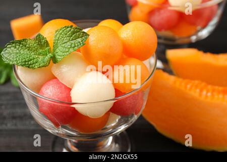 Melon and watermelon balls with mint in dessert bowl on table, closeup Stock Photo