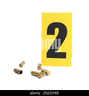 Shell casings and crime scene marker with number Stock Photo - Alamy