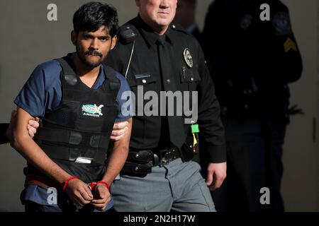 FILE- In this Nov. 28, 2012, file photo, Raghunandan Yandamuri is escorted from a Montgomery County district court after a preliminary hearing in Bridgeport, Pa. Yandamuri, who was sentenced to death in the killings of a baby and her grandmother in what prosecutors call a botched kidnapping plot, said Monday, April 13, 2015, that he's so dissatisfied with his attorneys he'd rather be executed now than continue seeking a new trial with them. (AP Photo/Matt Rourke, File)