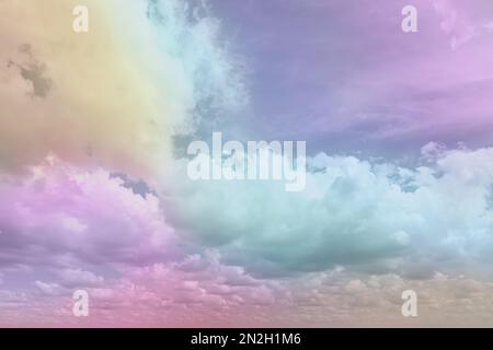 Fantasy world. Picturesque view of beautiful magic sky with fluffy clouds, toned in pastel rainbow or unicorn colors Stock Photo