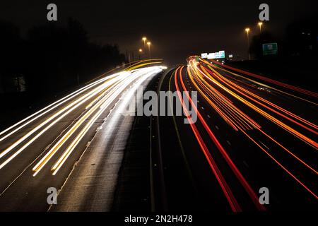 A long exposure shot of the traffic lights on the highway in St Charles, Missouri during the nighttime Stock Photo