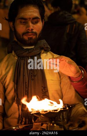Ganga Aarti, Hindu priest conducts religious Ganga Aarti ritual (fire ...