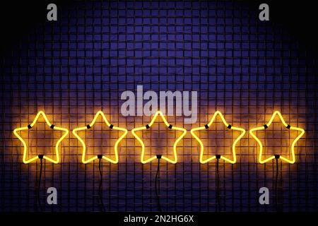 3D illustration of the five neon  yellow star arrow on a mesh wall. Realistic shiny signboard. Glowing star icon. Colored neon banner. Stock Photo