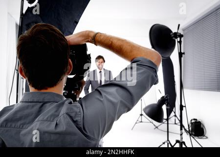 Master photographer. a photographer working in his studio. Stock Photo