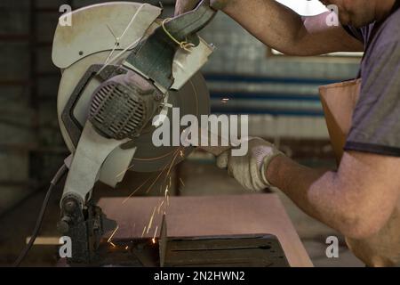 Items in garage. Workplace for creating structure. Production shop. Working tools on table. Stock Photo