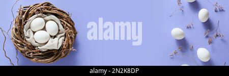 Banner with Easter eggs and space for text on lilac background Stock Photo