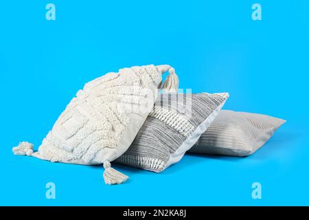 Set of decorative pillows on blue background Stock Photo