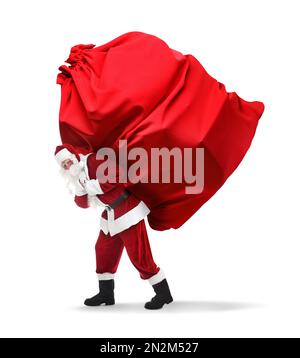 Santa Claus carrying enormous red bag full of Christmas gifts on white background Stock Photo