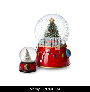 Beautiful snow globes with Christmas trees on white background Stock Photo