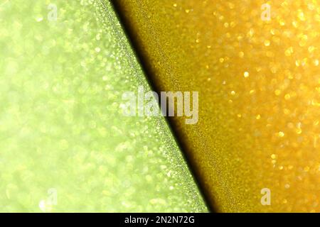 gold green glitter paper abstract, sparkle lights and bokeh, natural grunge texture background Stock Photo