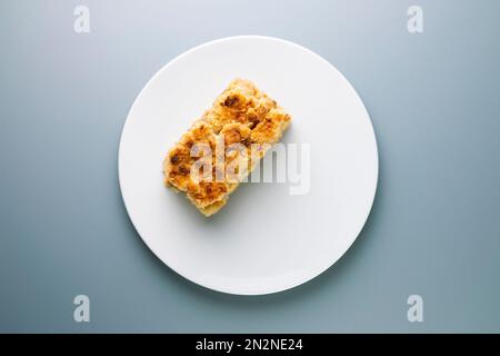 Apple crumble.The crumble is a cake with fruits. It is made with various fruits that are covered with a dough of flour, butter and sugar. Stock Photo