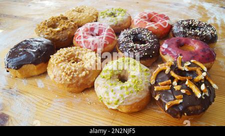 Variety of donuts. A donut, also called rosquilla, rosette, rosca or berlin, is a sweet bread roll that is traditionally fried in pork fat. Stock Photo