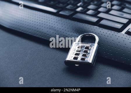 Computer security concept. A padlock on a computer keyboard. Stock Photo