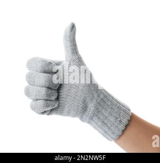 Woman in grey woolen glove showing thumb up gesture on white background, closeup Stock Photo