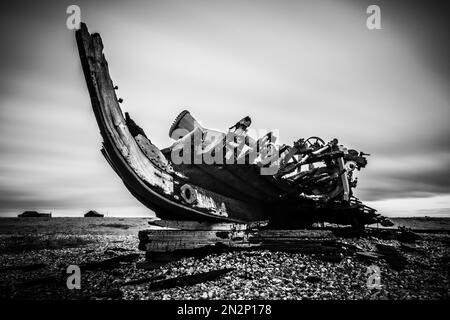 Ireland, Galway, 2016/04 , A red derelict wooden fishing boat lies decaying  on the shoreline of the, Stock Photo, Picture And Rights Managed Image.  Pic. WD2-3379940