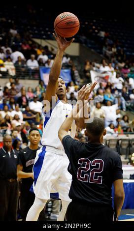 Bay Springs’ Jonnas Spivey (11) tries to shoot over the block of