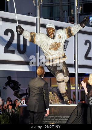 Former Los Angeles Kings' Luc Robitaille is greeted by fans as he walks  onto the ice at Staples Center during a ceremony retiring his jersey  number, 20, Saturday, Jan. 20, 2007, in