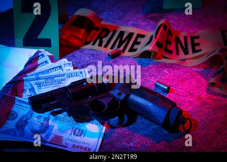 Gun, money and shell casings on wooden background. Crime scene Stock ...