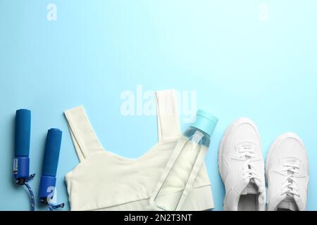 Running shoes, jump rope and drink bottle with green juice Stock Photo -  Alamy