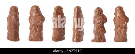 Chocolate Santa Claus figures on white background, views from different sides. Banner design Stock Photo