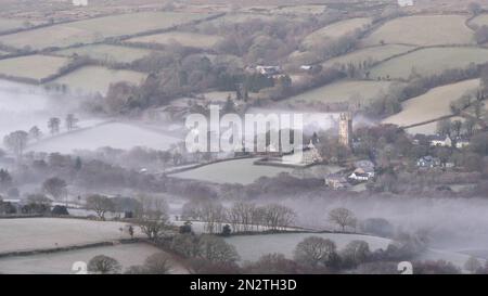 Widecombe-in-the-Moor, Dartmoor National Park, Devon, UK. 7th February 2023; UK Weather: Mist swirls in the valley near the village of Widecombe-in-the-moor on a frosty and chilly february morning. Credit: Celia McMahon/Alamy Live News Stock Photo