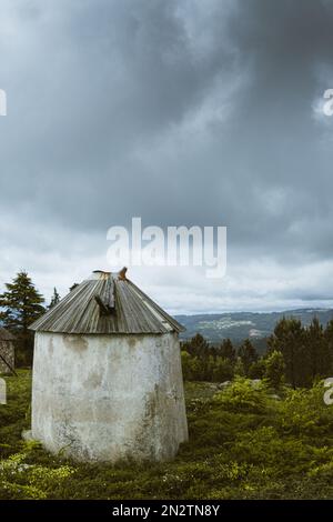 Old windmill in the Mountains, Portugal Stock Photo