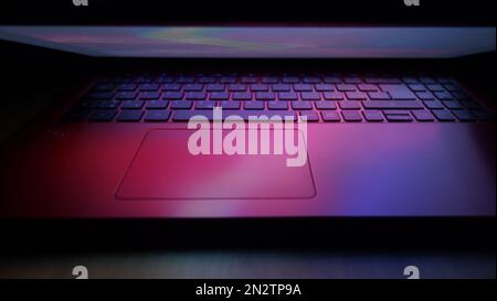 laptop computer keyboard illuminated with lights effects Stock Photo