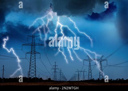 Picturesque lightning storm over field with high voltage towers Stock Photo