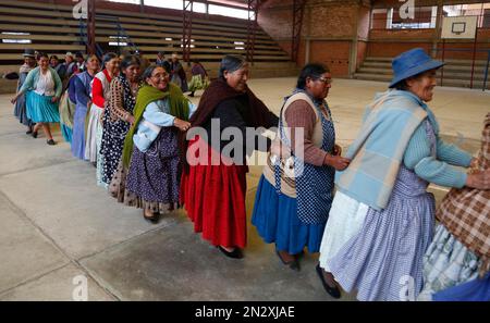 In this Feb. 11, 2105 photo, elderly Aymara indigenous women play handball  in El Alto, Bolivia. Team handball is an Olympic sport in which two teams  of pass a ball using their