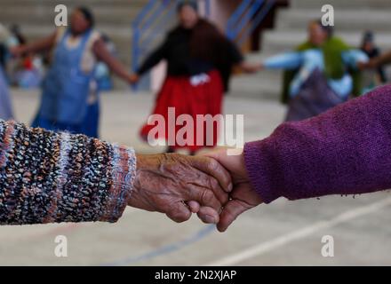In this Feb. 11, 2105 photo, elderly Aymara indigenous women play handball  in El Alto, Bolivia. Team handball is an Olympic sport in which two teams  of pass a ball using their