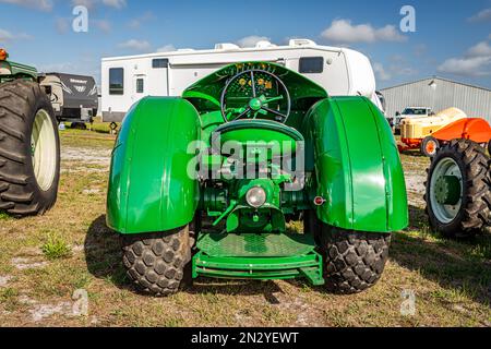 Fort Meade, FL - February 22, 2022: High perspective rear view of a 1950 Oliver 77 Orchard Tractor at a local tractor show. Stock Photo