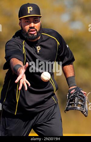 Pittsburgh Pirates Pedro Alvarez tosses his bat and walks to first