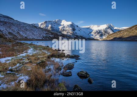 West across Llyn Ogwen and the snow covered Snowdonia Mountains, Gwynedd, North Wales Stock Photo