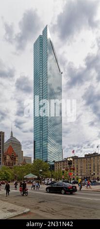 Boston Back Bay: 200 Clarendon Street, is the iconic former John Hancock Tower, a blue-tinted glass monolith that reflects the sky and all around it. Stock Photo