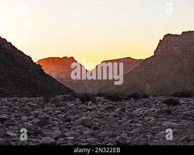 Sunrise as seen between the cliffs of the Fish River Canyon in Southern Namibia Stock Photo