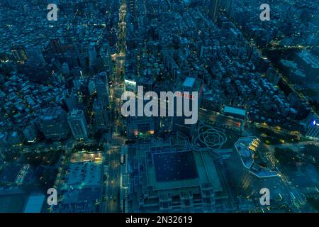 Looking down on Taipei city from the top storey of the Taipei 101 skyscraper in the evening. Stock Photo