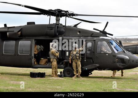 Six UH-60 Black Hawks Army Reserve Soldiers fired thousands of rounds of M240 ammunition during training, Fort Hunter Liggett, California. Stock Photo