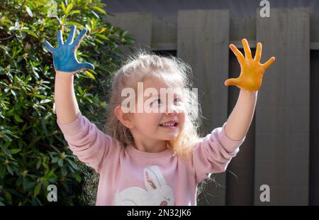 Love Ukraine concept. hands in heart form painted in Ukraine flag color - yellow and blue. id hands painted in blue and yellow flag of Ukraine. Ukrain Stock Photo