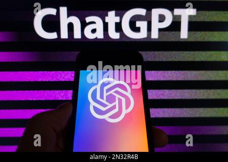 Digital composite image of OpenAI ChatGPT logo shown on mobile phone Stock Photo