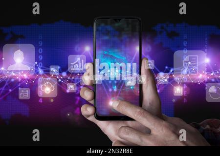 Big data technology background. Using smartphone against the background of visualization of a computer internet network, social connection, analytics, information. High quality photo Stock Photo