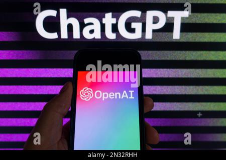 Digital composite image of OpenAI ChatGPT logo shown on mobile phone Stock Photo